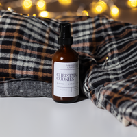 Christmas Cookies room and linen spray with a plaid blanket and christmas lights in the background