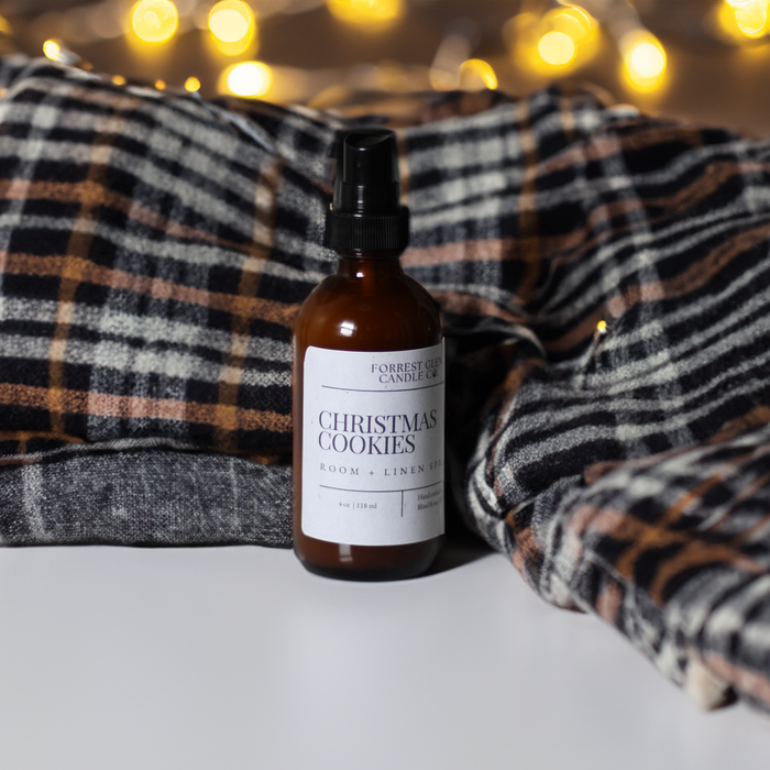 Christmas Cookies room and linen spray with a plaid blanket and christmas lights in the background