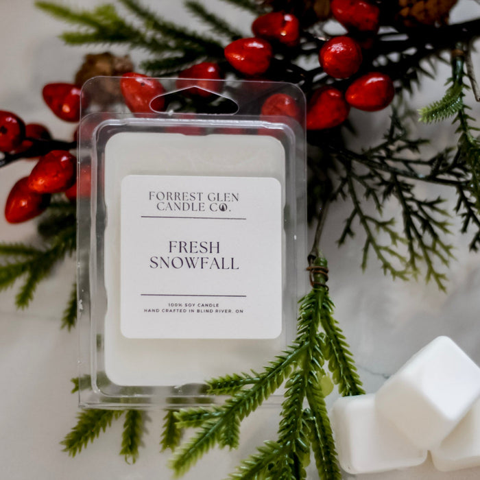 Forrest Glen Candle Co. Fresh Snowfall wax melt package with Christmas decorations.