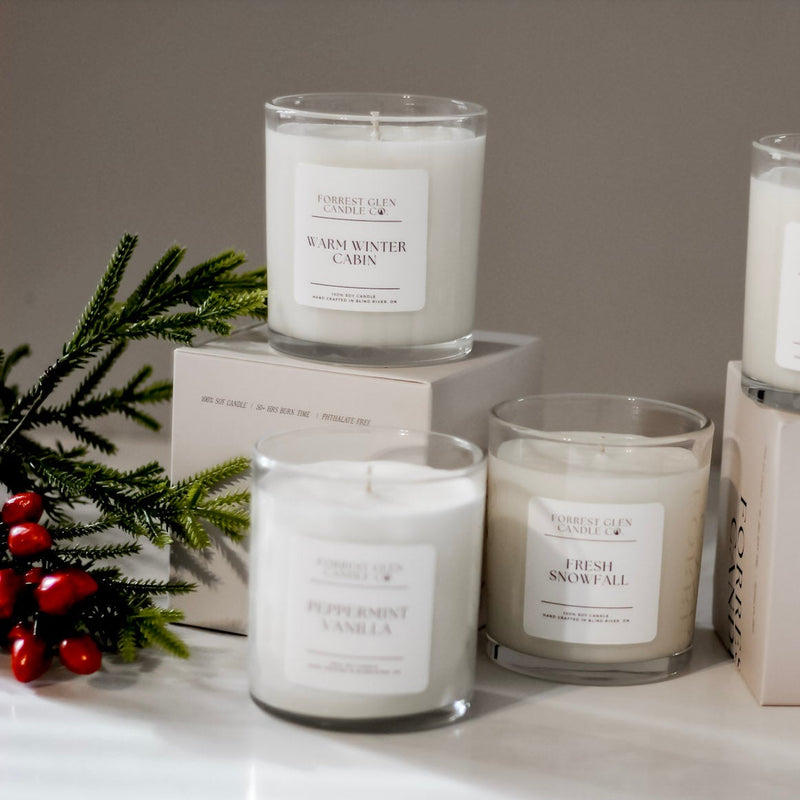 Set of candles with labels and boxes on a white surface