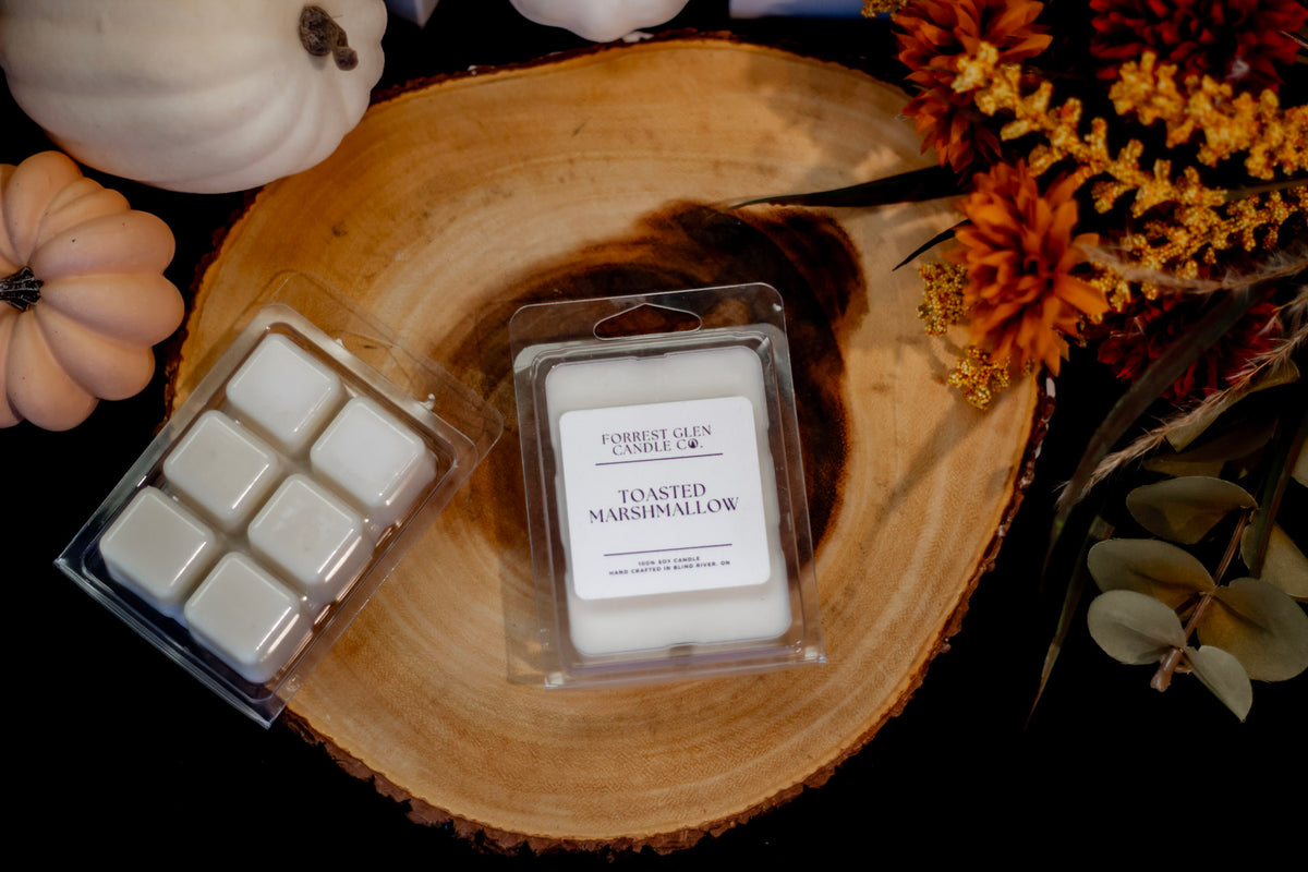 Toasted Marshmallow Wax Melt on rustic wooden slab with fall decor